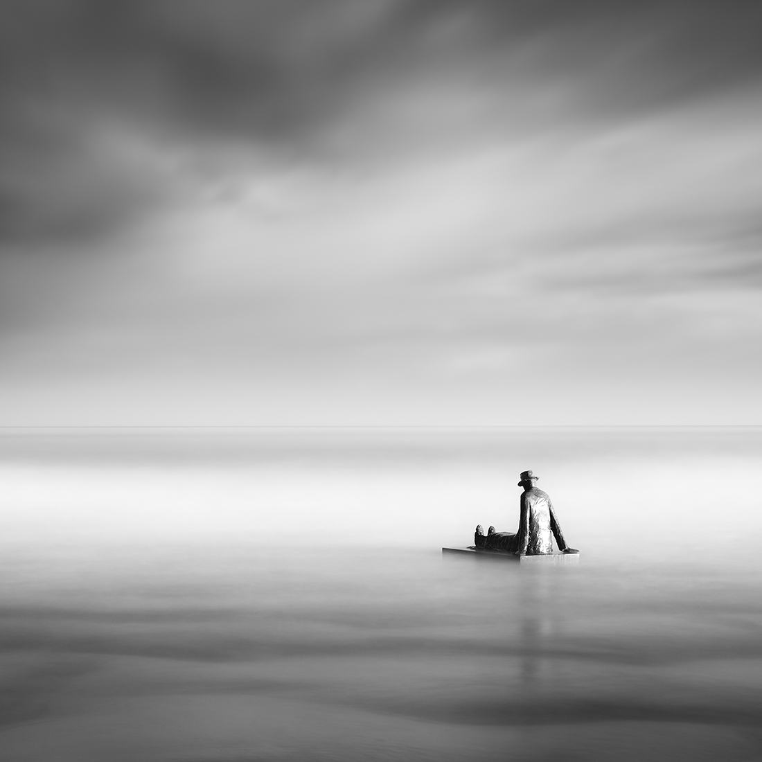 Folon sculpture in the sea at Knokke