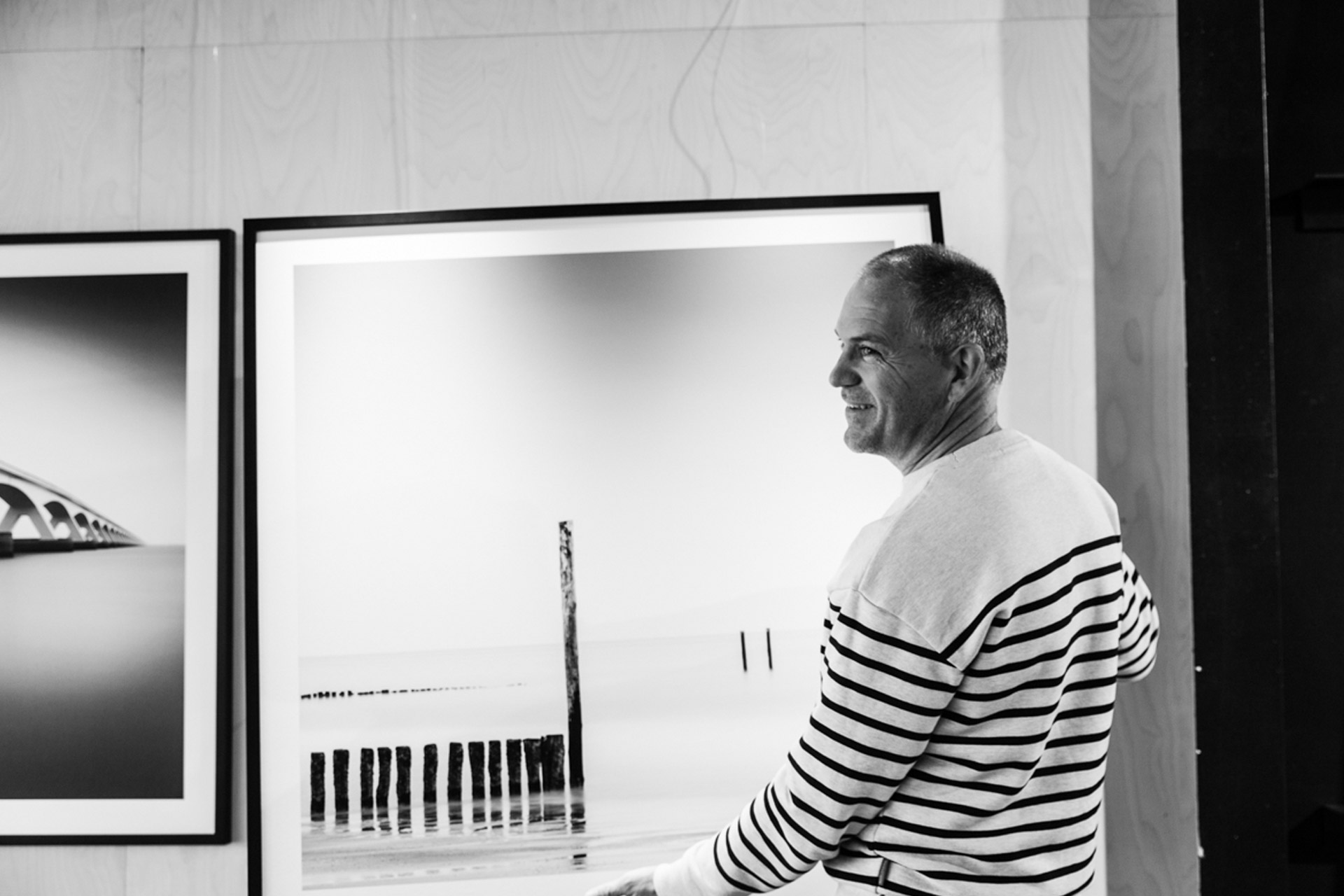 Patrick Van Den Broucke with his photographic prints